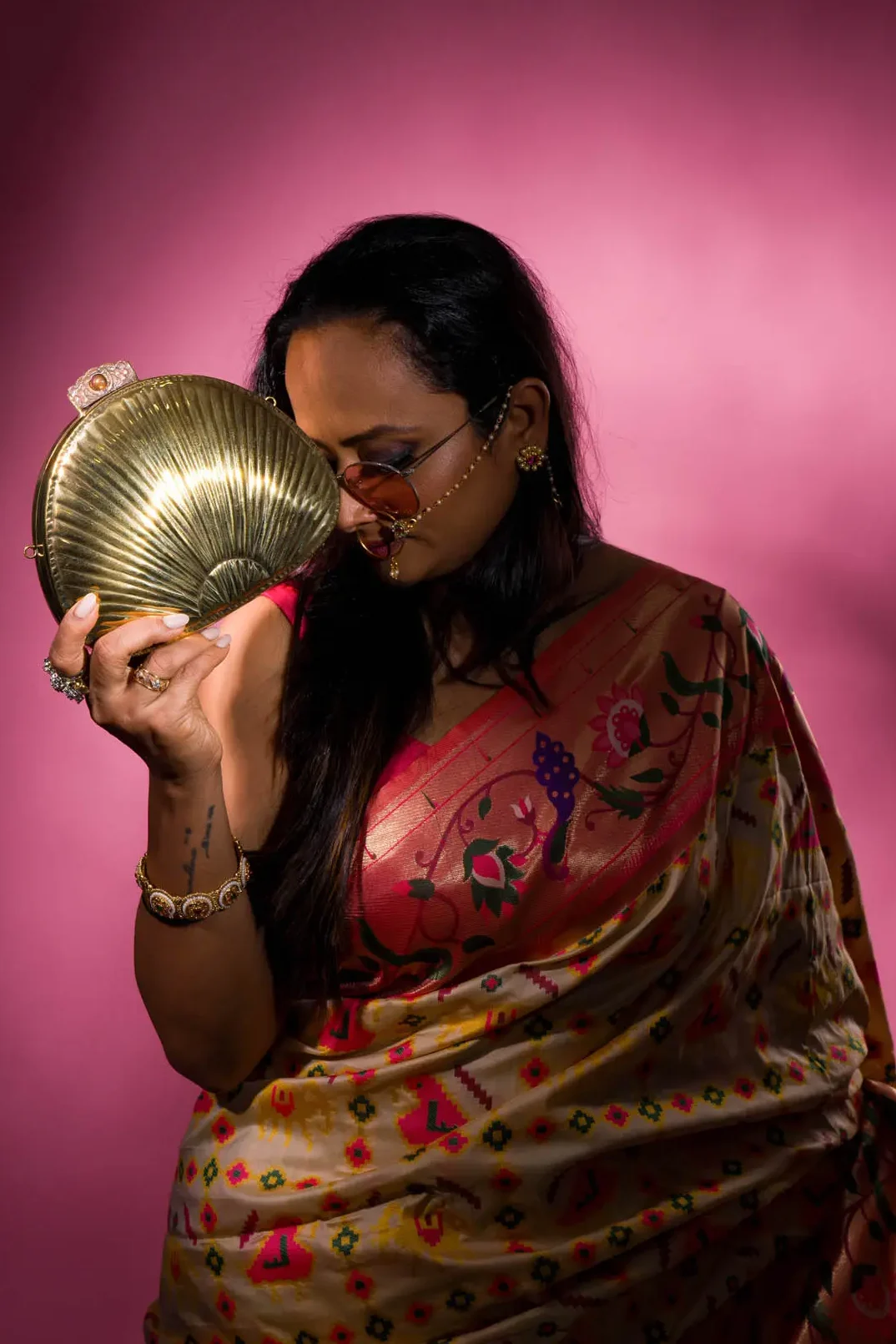 Tash Bags campaign — Theme 02, model in shadow with lit brass product